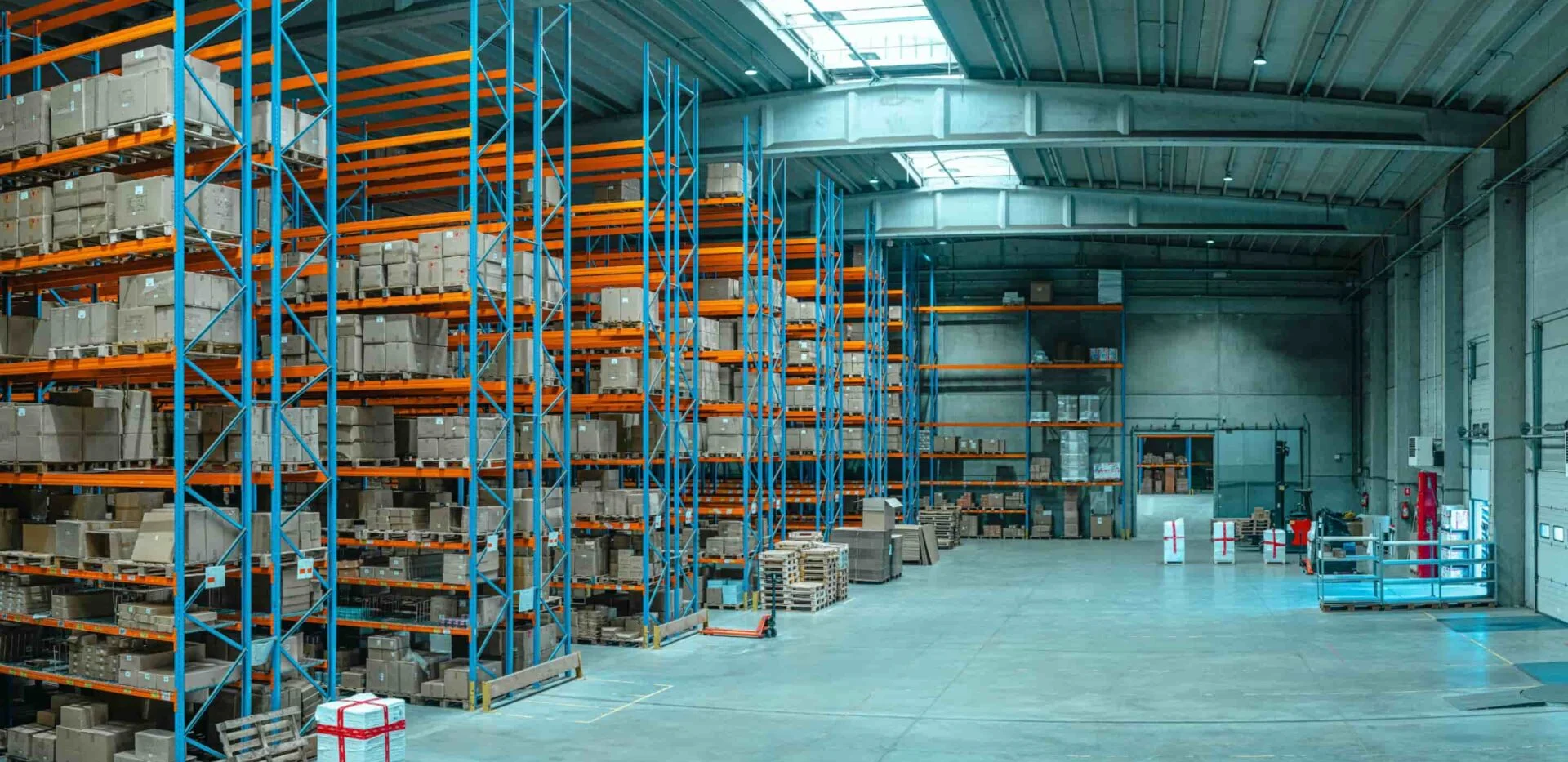 A commercial warehouse with open floor areas and storage aisles